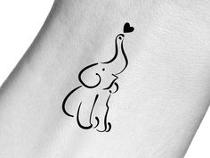 an elephant with a heart on it's back is shown in black ink, and has