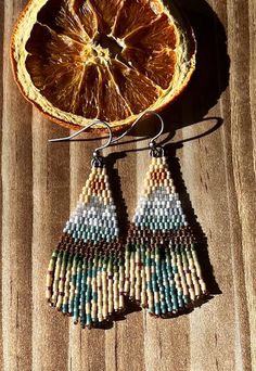 Delica beaded mountain scenery earrings with silver accents.  2 inches long  1 inch wide Mountain Seed Bead Earrings, Earthy Beaded Drop Earrings, Mountain Scenery, Beaded Earring, Seed Bead Patterns, Delica Beads, Bead Patterns, Seed Bead Earrings, Bead Earrings