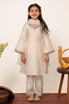 Shop for this happy collection of Ivory Chanderi Silk Embroidered Floral Placement Kurta Pant Set For Girls by Boteh online at Aza Fashions.