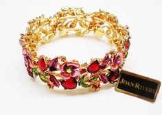 Finished in gold tone, signed Genuine Austrian crystals . Comes with box,pouch and romance card Box Pouch, Snake Bracelet, Spring Fever, Rose Rouge, Joan Rivers, Red Hearts, Flower Bracelet, Flower Heart, Austrian Crystal