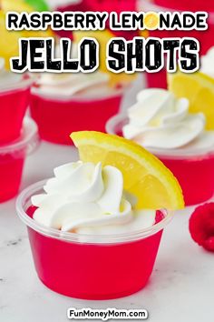 raspberry lemonade jello shots in plastic cups with whipped cream on top