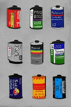 a bunch of different types of batteries on a gray surface with black and white writing