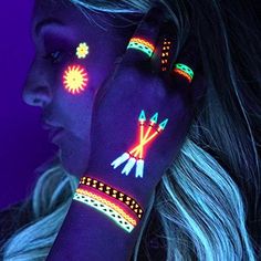 a woman with glow tattoos on her hands