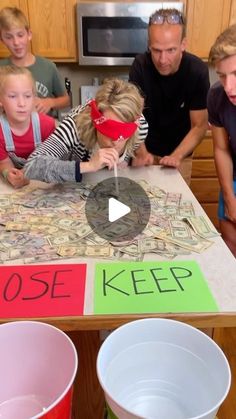 a group of people sitting around a table with money on it and the words choose keep