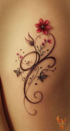 the back of a woman's stomach with flowers and butterflies tattoo on her side