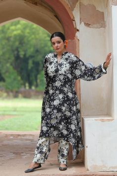 An anti-fit kurta featuring digital print crafted out of soft Chanderi silk. It is paired with narrow pants and comes as a set of 2. Fabric : Chanderi Colour : Black & white Embroidery details : Hand embroidery No.of components : 2 Delivery time : 15-20 days Washing Instructions : DRY CLEAN ONLY Eid Straight Kurta With Set-in Sleeves, Traditional Kurta With Set-in Sleeves For Eid, Festive Straight Kurta With Set-in Sleeves, Cotton Silk Kurta With Set-in Sleeves, Cotton Silk Straight Kurta With Set-in Sleeves, Traditional Designer Kurta With Set-in Sleeves, Traditional Cotton Silk Kurta With Set-in Sleeves, Silk Straight Kurta With Printed Motifs, Traditional Silk Kurta With Set-in Sleeves