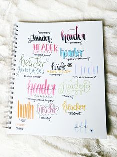 a notebook with some writing on it and the words written in different colors are next to each other