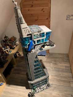 a model of a building made out of legos on a table in a room