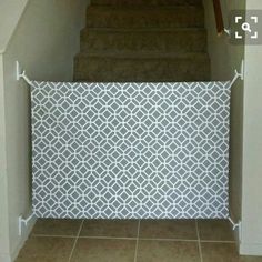 a stair case with white and grey tile on it