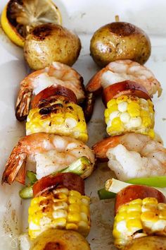 grilled shrimp and corn on the cob with potatoes