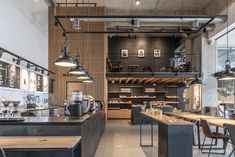 the interior of a coffee shop with tables and chairs