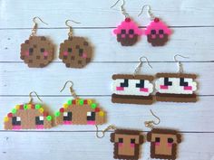 the pixel earrings are made out of wood and have different colored beads on each ear