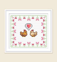 a cross stitch pattern with two chickens and a heart