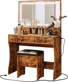 a wooden vanity table with a mirror and hair dryer