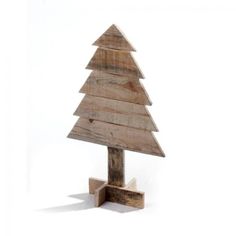 a small wooden christmas tree on a stand