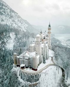 an aerial view of a castle in the snow