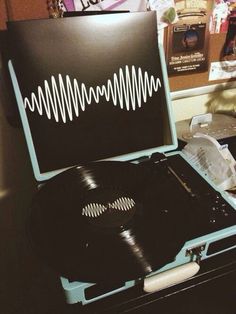 an open record player sitting on top of a table