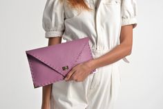 "Symmetria mat clutch in lilac purple. The perfect bag for all occasions! Ideal for cocktail and parties or for business meetings depending the size you choose. It comes in two sizes, small and large. You can use it as a chic briefcase for your work or as a modern large clutch bag for a night out. This adorable clutch is handmade out of a genuine, premium Italian cow leather in a lilac purplee color. -Small size fits all your essentials, wallet, keys, mobile, cosmetics etc. -Large size fits a 15 Pink Clutch Bag, Purple Clutch, Purple Envelope, Leather Laptop Case, Yellow Jeans, Pink Clutch, Large Clutch, Women Business, Leather Clutch Bag