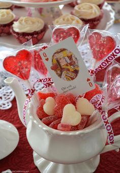 valentine's day cupcakes and candy in a teapot