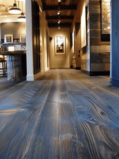 the inside of a house with wood flooring