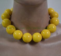 jewelry: yellow beaded necklace - 25.5mm Big yellow beaded necklace - men Necklace - gift for him - gift for her bead material: Resin clasp: stainless steel lobster clasp and a 2 inches adjustable chain Diameter: 25.5mm Shape : round Luster: High body: sometime with small pits Necklace length: choose colour: yellow  Packing:Beautiful Pouch If you want to order of different style. Please feel free contact me . Thank you . The other 29-30mm necklaces: https://www.etsy.com/shop/goodglasspearl?ref=s Elegant Yellow Beads Gift, Elegant Yellow Beads For Gifts, Yellow Beaded Necklaces With Large Beads As Gift, Yellow Beaded Necklaces With Large Beads For Gifts, Luxury Yellow Necklaces With Round Beads, Yellow Jewelry With Large Oval Beads, Elegant Yellow Necklace With Large Beads, Yellow Polished Beads For Gifts, Playful Yellow Round Beads Jewelry