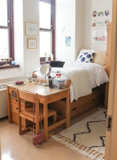 a bedroom with a bed and desk in it