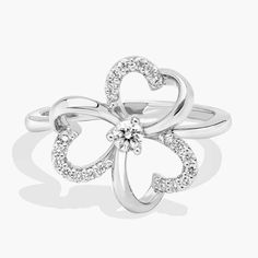 This diamond heart flower ring, handcrafted in 14k yellow gold, adds a feminine (not to mention brilliant) touch. Wedding Ring Guide, Pearl Bracelet Gold, Platinum Rose Gold, Diamond Fashion Rings, Engagement Rings Marquise, Gold Rings Fashion, Heart Flower, Gold Pearl Necklace, Ladies Diamond Rings