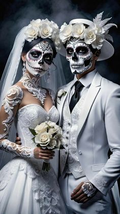 a man and woman in white wedding attire with skeleton makeup on their faces, standing next to each other