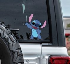 an image of a cartoon character on the back of a car window with it's sticker