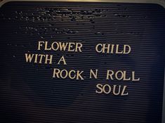 a sign that says flower child with a rock n roll soul