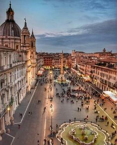 an aerial view of a city square at dusk