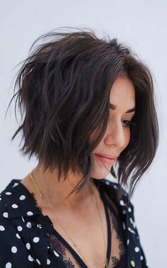 Short shaggy bob cut with textured layers, adding volume and a stylish, modern look