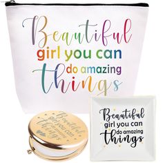 a white bag with colorful lettering on it next to a small mirror and other items