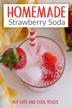 a strawberry soda in a glass with ice and strawberries