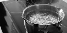 a pot filled with boiling water on top of a stove