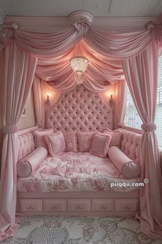 a pink bed with lots of pillows and curtains