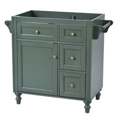 a green cabinet with drawers and two doors