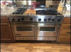 a stainless steel stove and oven in a kitchen