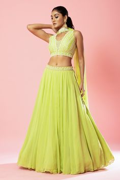 Lime green attached can-can lehenga with hand embroidered waistband. Paired with a padded, sleeveless blouse with all over hand embroidery in cutdana, sequin, pearls, threads and beads. Comes along with a choker dupatta.
Components: 3
Pattern: Hand Embroidery
Type Of Work: Cutdana, Sequin, Pearls
Neckline: V Neck
Sleeve Type: Sleeveless
Fabric: Georgette
Color: Green
Other Details: 
Padded blouse
Attached can-can
Attached inner lining
Back cut-out blouse
Approx Weight: 3kg
Occasion: Sangeet - Az Lightweight Lehenga, Off Shoulder Lehenga, Royal Blue Lehenga, Pleated Lehenga, Ruffle Lehenga, Lehenga And Blouse, Raw Silk Lehenga, Yellow Lehenga, Pearl Work