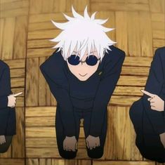 an anime character with white hair and black glasses sitting on a wooden floor next to another character