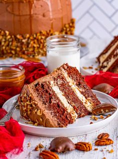 a slice of cake on a plate with pecans around it