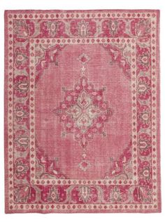 a pink rug with an ornate design on the front and back side, in various colors