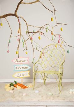 an egg hunt sign next to a bench and carrots