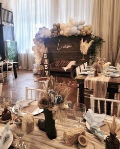 a table is set up with balloons and other decorations