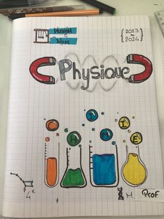 a notebook with the words physique written on it and colored flasks