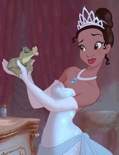 the princess and the frog is holding a frog in her hand while standing next to a dresser