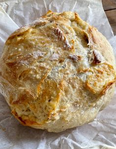 a baked bread sitting on top of a piece of wax paper