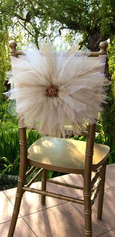 a chair with a flower on the back