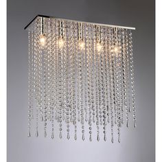 a chandelier with three lights hanging from it's sides and some crystal beads on the bottom