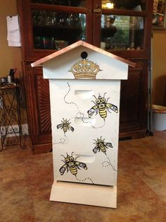 the beehive is decorated with gold and white designs